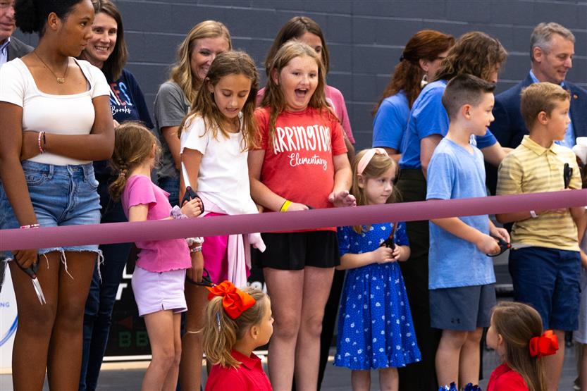 Students cut ribbon at new school